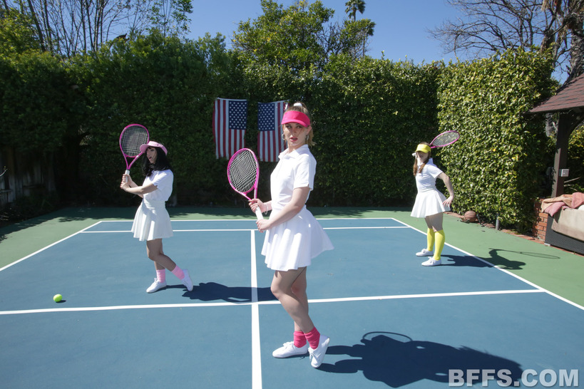 Tennis Whites and Pink Visors in a Court-Side Group Scene photo 9