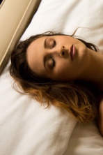 Busty brunette Ashley Adams posing naked on her bed 09