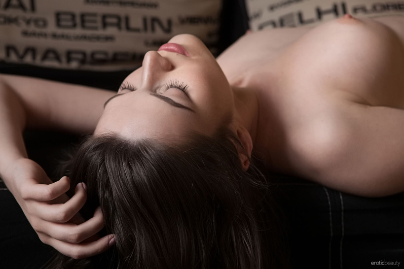 Nude Brunette on a Black Sofa and Zebra Rug photo 19