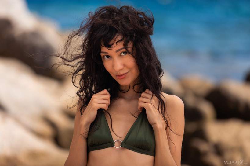 Violet Amrita in a Black Bikini on Rocky Shore photo 3