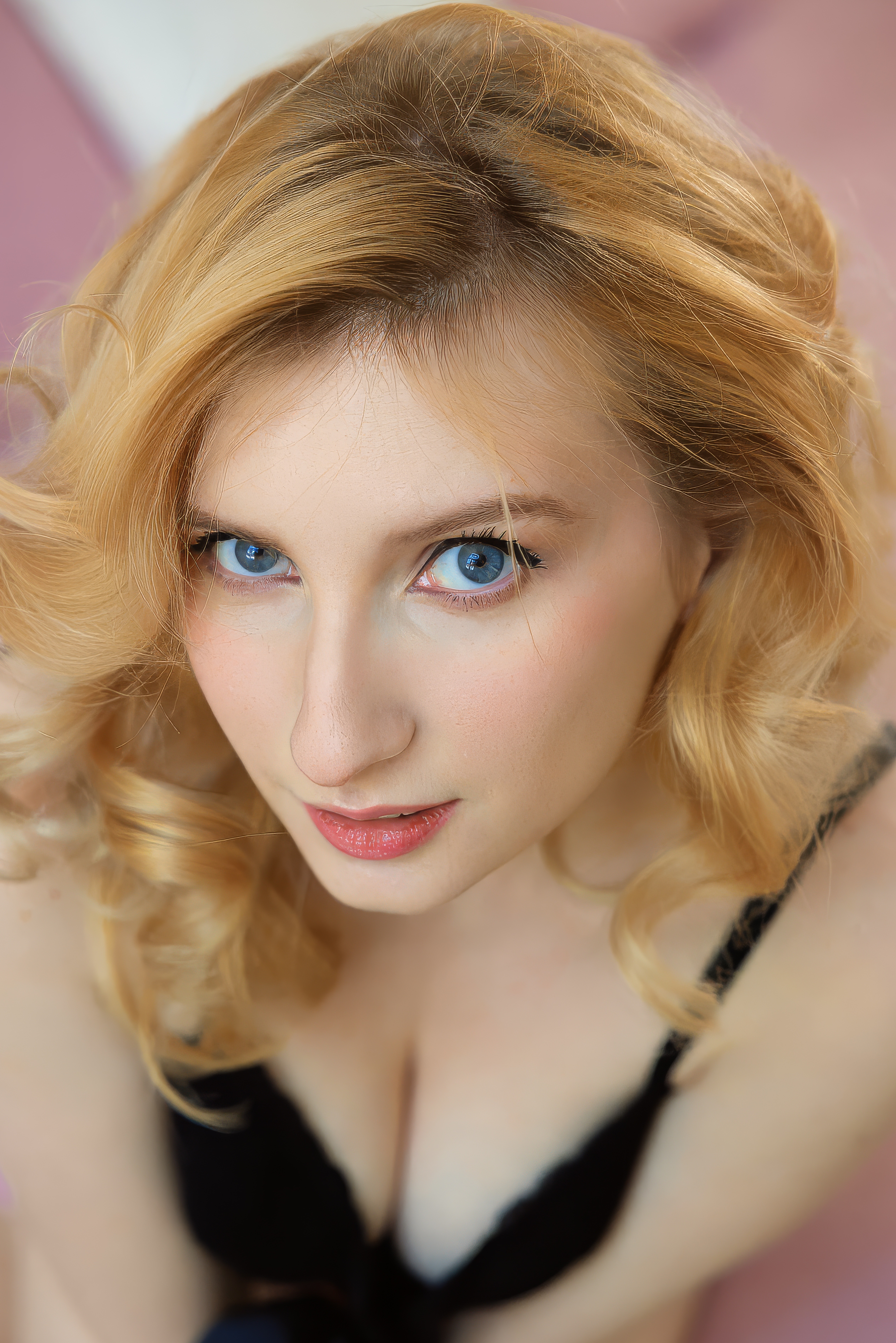 Blonde Nude Posing on a Soft Pink Bed
