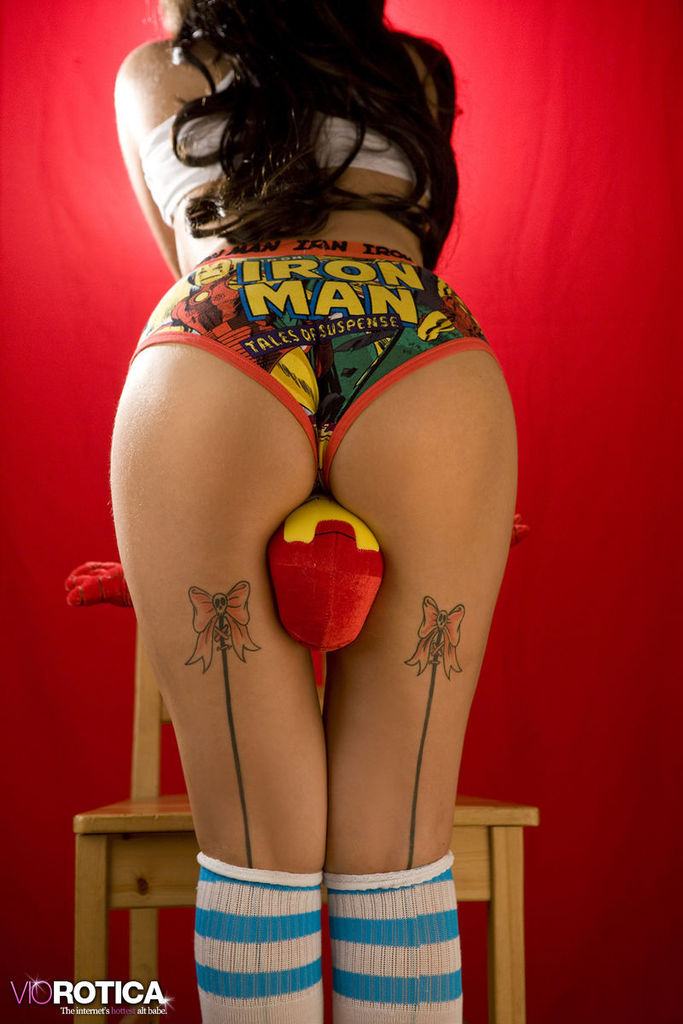Iron Man Cosplay Pin-Up Against a Red Studio Backdrop photo 16