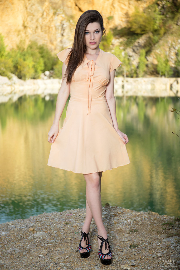 Serena posing outdoor in sexy dress photo 1